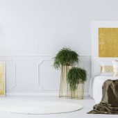 gold-painting-in-elegant-bedroom-PHWJZBN-scaled.jpg